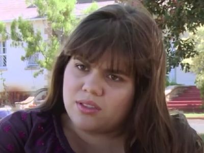 Brooke Markham is sitting outside in the garden talking to someone.